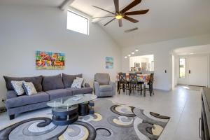 a living room with a couch and a table at Cathedral City Gem 6 Mi to Downtown Palm Springs! in Cathedral City