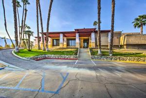 a house with palm trees in front of a driveway at Cathedral City Gem 6 Mi to Downtown Palm Springs! in Cathedral City