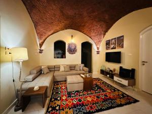 a living room with a couch and a rug at West Bank luxury villa in Luxor