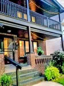 a brick house with a balcony on top of it at Lovely! near Cleve Clinic/UH/CWRU/Dwntwn w/porch in Cleveland