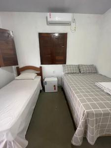 Cama ou camas em um quarto em Sítio Paraíso do Caju