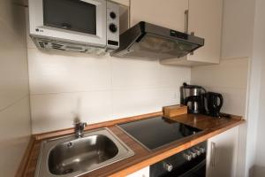 Η κουζίνα ή μικρή κουζίνα στο Dat Ferienhus Norddeich Ferienwohnung 6 +4 φωτογραφίες