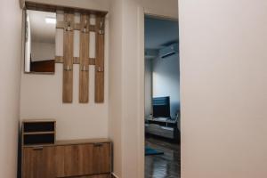 a hallway with a mirror and a desk in a room at Mare's Corner in Ohrid