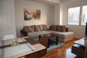 a living room with a couch and a table at Mare's Corner in Ohrid