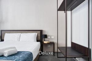 Giường trong phòng chung tại Hotel Vitruvio