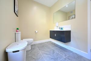 a bathroom with a toilet and a sink at Fabulous duplex apartment in Dalston Junction in London