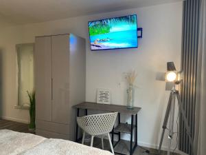 TV a/nebo společenská místnost v ubytování Beach II Appartement