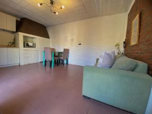 a living room with a couch and a table at Hospedaje Noah in Ezeiza