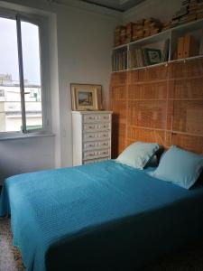 Voodi või voodid majutusasutuse Camera Blu toas