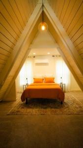 a bedroom with a bed in an attic at NJ Lakefront A-Frame, Millville, NJ - 2 bedroom Cabin Home in Millville