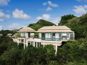 an aerial view of a house in the trees at Banyan Tree Samui in Lamai