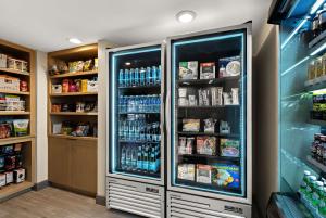 a refrigerator filled with lots of drinks in a store at Sonesta ES Suites Denver South Park Meadows in Lone Tree