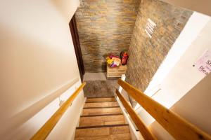 a staircase in a house with a brick wall at Airstaybnb in Manchester