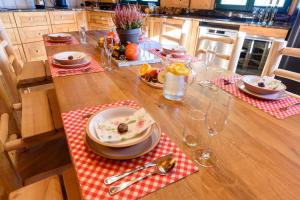 a wooden table with a plate of food on it at SRUB KVETONOV in Kaplice