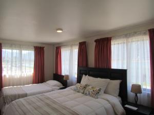 Ένα ή περισσότερα κρεβάτια σε δωμάτιο στο Hostería Antupirén +78 φωτογραφίες