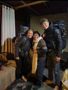 a man and two women posing for a picture at Garden Guest House in Trujillo