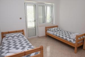 Posteľ alebo postele v izbe v ubytovaní Holiday house with a parking space Podstrana, Split - 6044