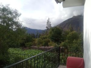 a balcony with a view of a mountain at Casa de Mama Valle - Urubamba in Urubamba