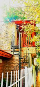 a brick building with a fire escape on the side of it at Sophenia in Agrelo