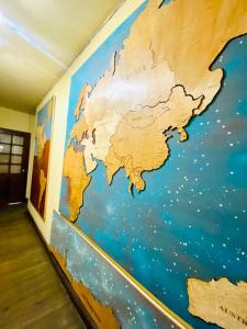 a mural of a map of the world on a wall at Central Chapinero House in Bogotá
