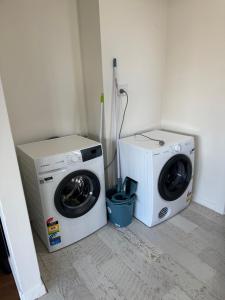 a washing machine and a washer in a room at Away on Blende Studio Loft in Broken Hill