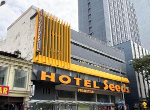 a hotel sign on the side of a building at Seeds Hotel Chow Kit in Kuala Lumpur
