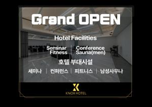 a picture of a room with a sign that says grand open at KNox Hotel in Cheonan