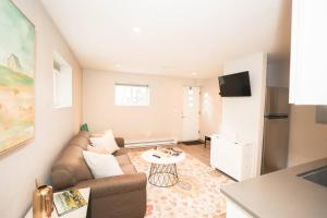 a living room with a couch and a table at Bridger Hawk Suite (NEW) in Bozeman