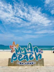 a sign that says miami beach dancing on the beach at Modern Seaview Apt next to Walking St & My An Beach in Da Nang
