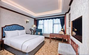 TV o dispositivi per l'intrattenimento presso Guangming CIMC Executive Hotel Shenzhen