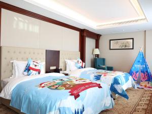 Letto o letti in una camera di Guangming CIMC Executive Hotel Shenzhen