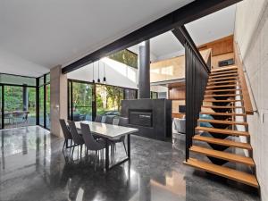 a dining room and kitchen with a table and chairs at SpaceNature in Margaret River Town