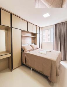 En eller flere senge i et værelse på Apartamento vista para o mar