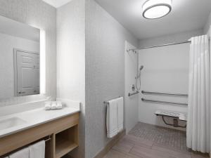 a bathroom with a sink and a shower at Holiday Inn Express Fort Bragg by IHG in Fort Bragg +47 photos