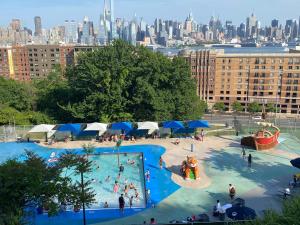 an aerial view of a swimming pool in a city at Charming and cozy apartment in New Jersey close to all the fun 10 minutes to NYC in West New York