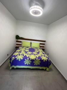 A bed or beds in a room at Serenity Lodge Tahiti Fare Haumana