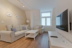 Televízia a/alebo spoločenská miestnosť v ubytovaní Imperial Apartments - Molo