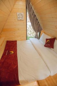 a bed in a small room in a tiny house at Sapa the chill garden& villas in Lao Cai