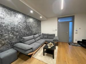 a living room with a couch and a table at Casa di Jo in Empoli