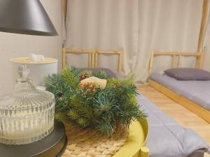 a living room with a table with plants on it at NK House in Gangneung