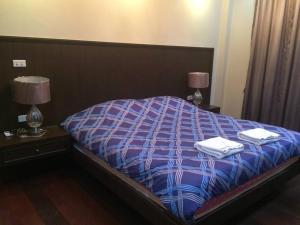 Postel nebo postele na pokoji v ubytování บ้านพักตากอากาศ Bonanza Khao Yai (Pinny)