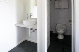 a bathroom with a sink and a toilet at Sole East Beach in Montauk