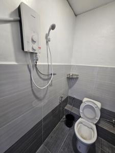 a bathroom with a shower with a toilet at SS HOSTEL PENANG in George Town