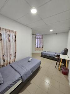 Postel nebo postele na pokoji v ubytování SS HOSTEL PENANG