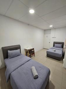 Postel nebo postele na pokoji v ubytování SS HOSTEL PENANG