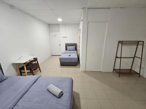 Postel nebo postele na pokoji v ubytování SS HOSTEL PENANG