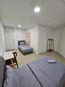 Postel nebo postele na pokoji v ubytování SS HOSTEL PENANG