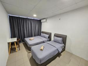 Postel nebo postele na pokoji v ubytování SS HOSTEL PENANG