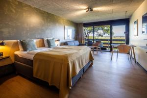 Voodi või voodid majutusasutuse Fjordgaarden - Spa - Hotel - Konference toas