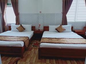 Postel nebo postele na pokoji v ubytování Sơn Tùng Motel